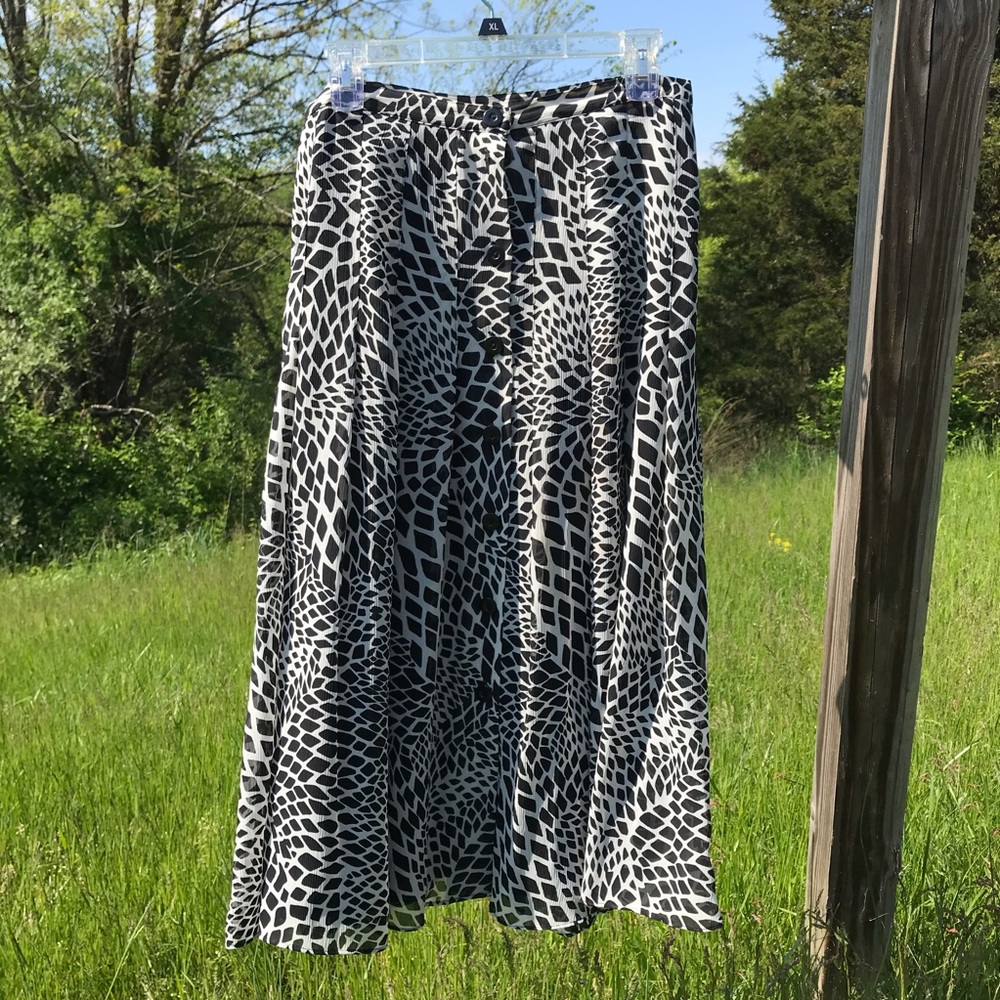 Swingy pleated button front skirt